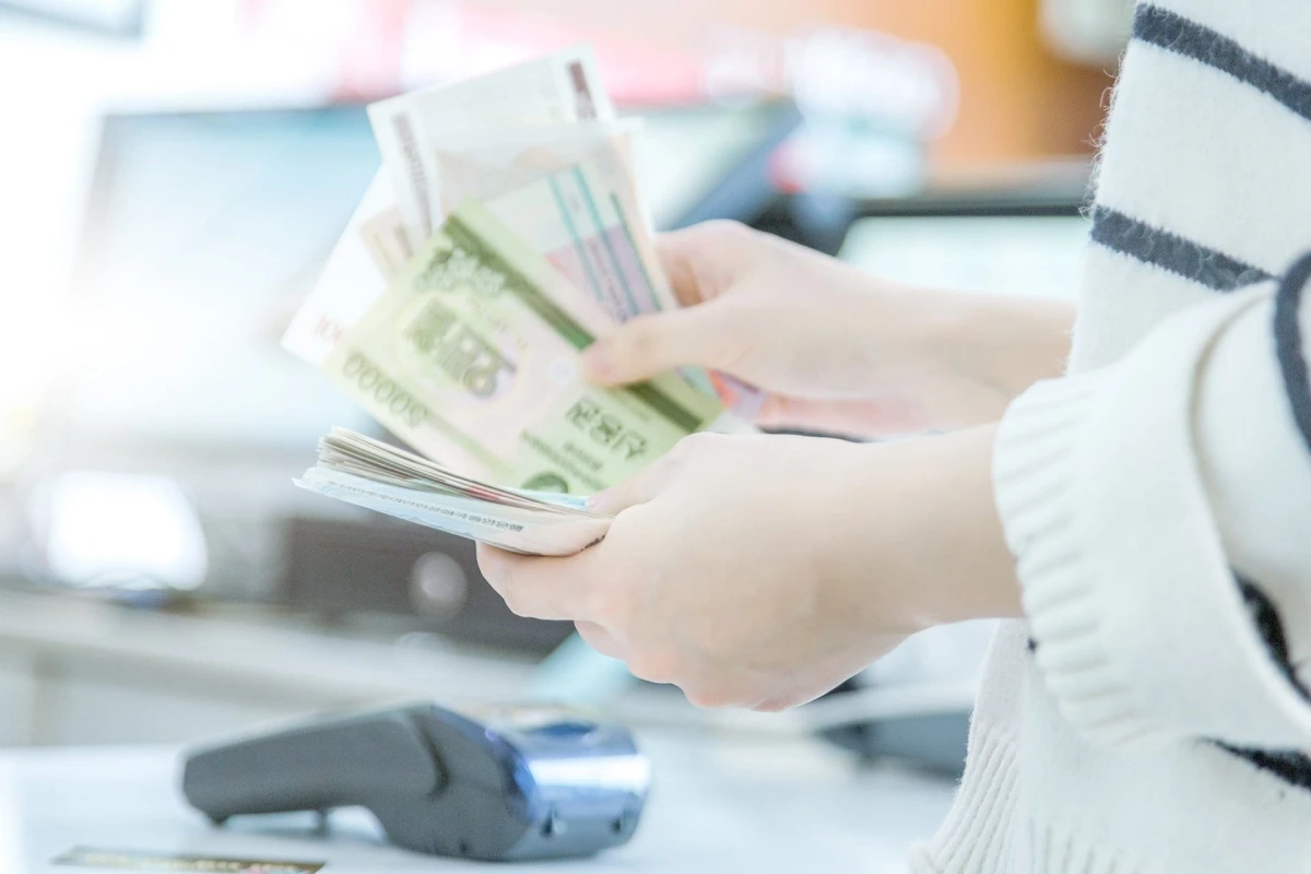 cash and card payment with chip and pin machine in shop